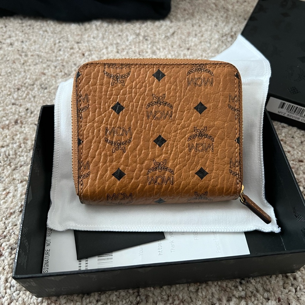 Pre Owned MCM wallet. Original Box and Dust Cloth